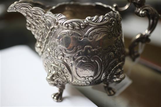 An ornate silver cream jug, 14.5 oz.